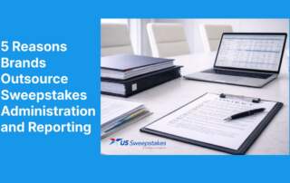 Modern office desk with contract documents, binders, and a laptop displaying reports, representing outsourcing sweepstakes administration and reporting for brands.